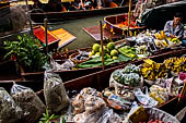 Thailand, Locals sell fruits, food and products at Damnoen Saduak floating market near Bangkok 